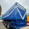 Feichi 4 Axles Heavy Transport Cargo High Side Fence Semi Trailer Fence Flatbed Truck Trailer Fence Cargo Semi Truck Trailer